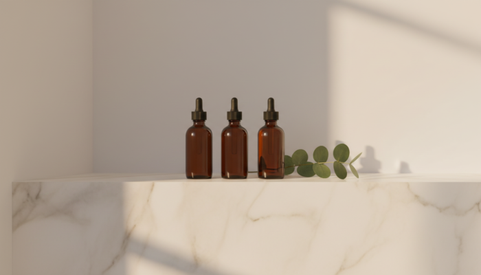 Dark amber Drunk Elephant skincare bottles on a marble bathroom shelf — clean beauty morning ritual