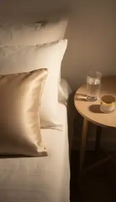 Silk pillowcase and skincare cream for overnight skin repair