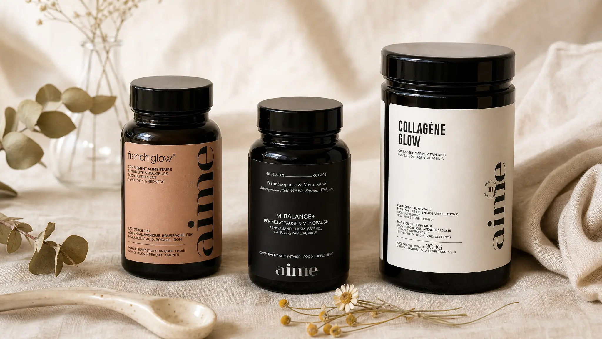 AIME French Glow, M-Balance+ and Collagène Glow supplements flat-lay — AIME supplements review for gut-skin axis and beauty from within