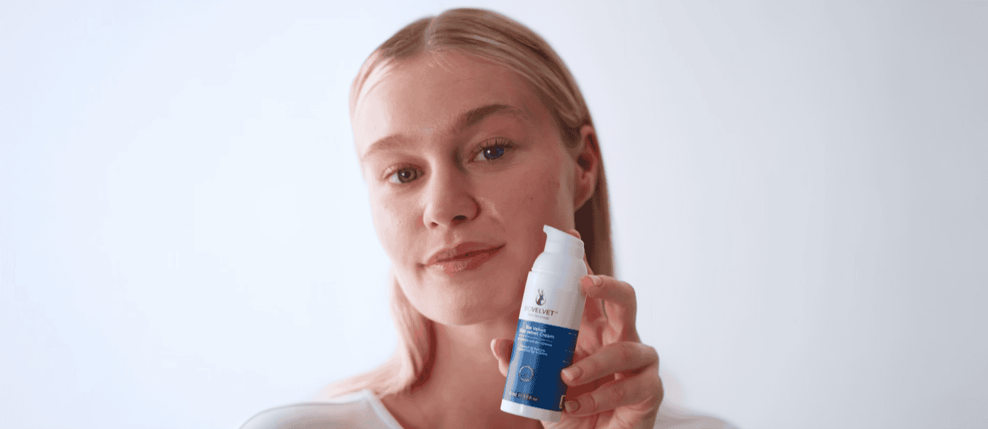 Woman holding BioVelvet Deer Velvet serum bottle — best niche skincare for sensitive skin